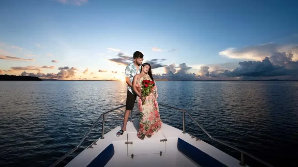 a newly wed couple posing on a boat
