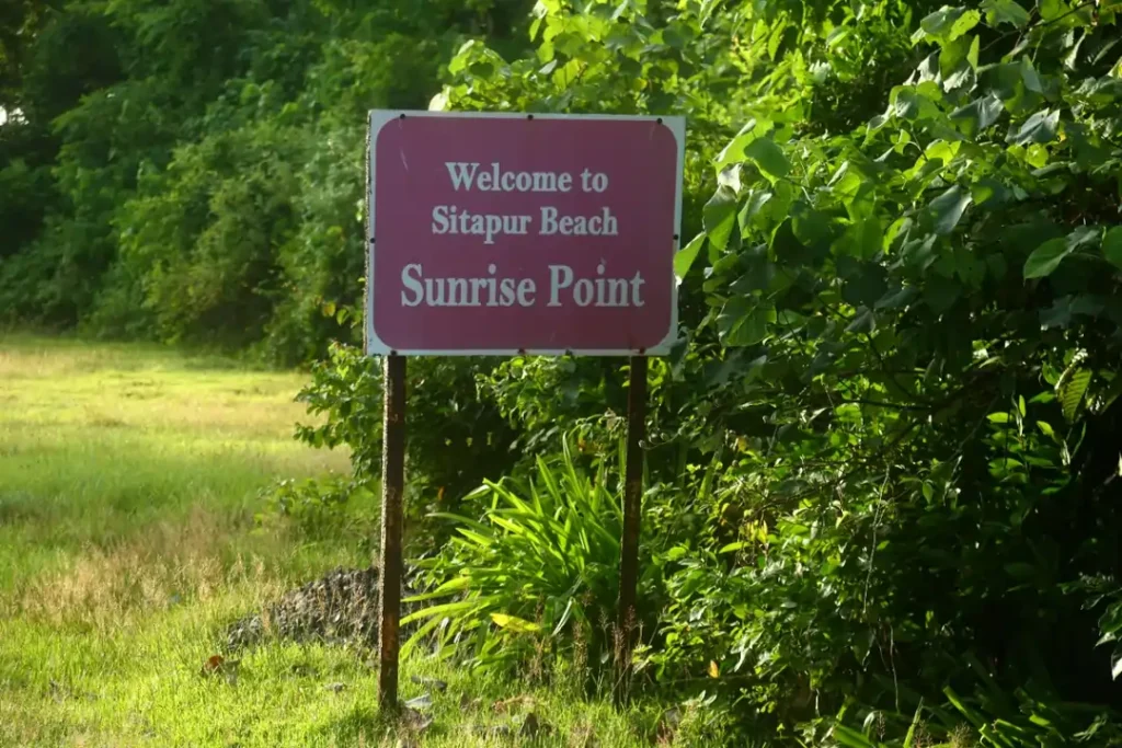 a sign board saying 'Welcome to Sitapur Beach Sunrise Point'